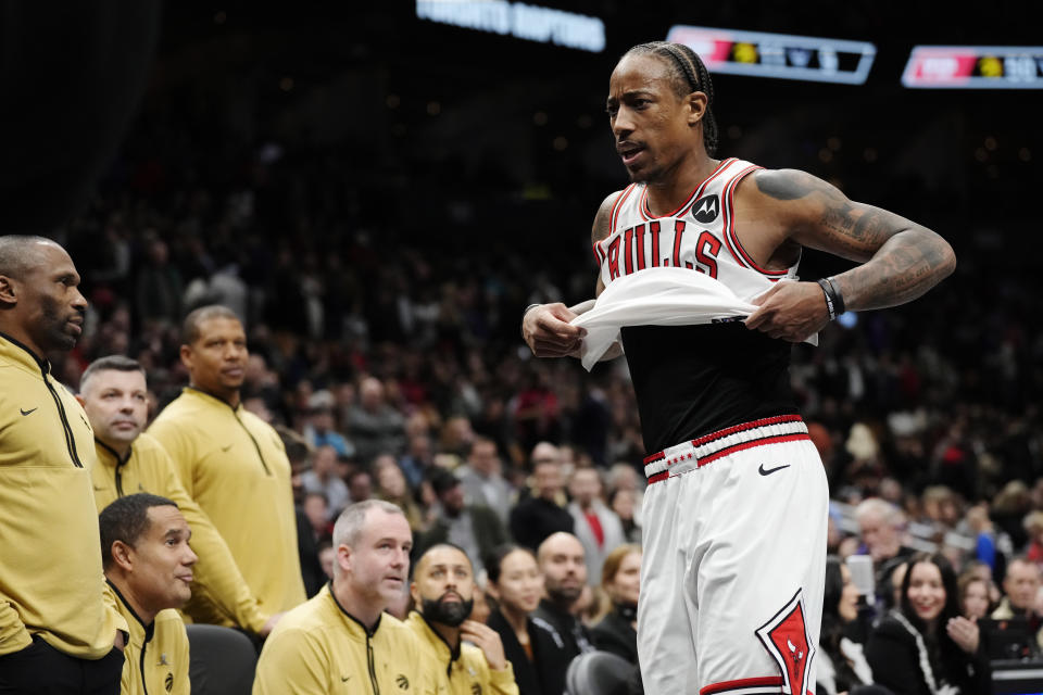 Chicago Bulls' DeMar DeRozan (11) walks past the Toronto Raptors' bench after being ejected during the second half of an NBA basketball In-Season Tournament game Friday, Nov. 24, 2023, in Toronto. (Frank Gunn/The Canadian Press via AP)