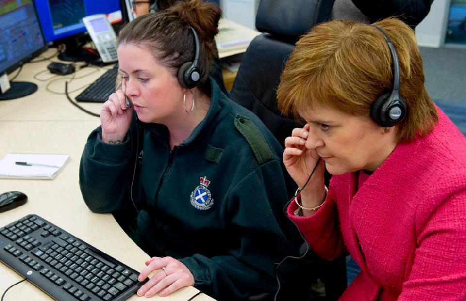 First Minister Nicola Sturgeon listens into a 999 call during a previous tour of a Scottish Ambulance Service call centre (Garry F McHarg/Daily Record/PA) (PA Archive)