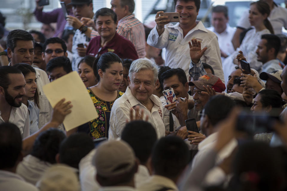 Mexican President Andres Manuel Lopez Obrador arrives to a military nature reserve for an event with El Salvadorian President Nayib Bukele near the border town of Tapachula, Mexico, Thursday, June 20, 2019. Lopez Obrador met with El Salvador's president to discuss a development plan that aims to slow a surge of mostly Central American migrants toward the U.S. border. (AP Photo/Oliver de Ros)