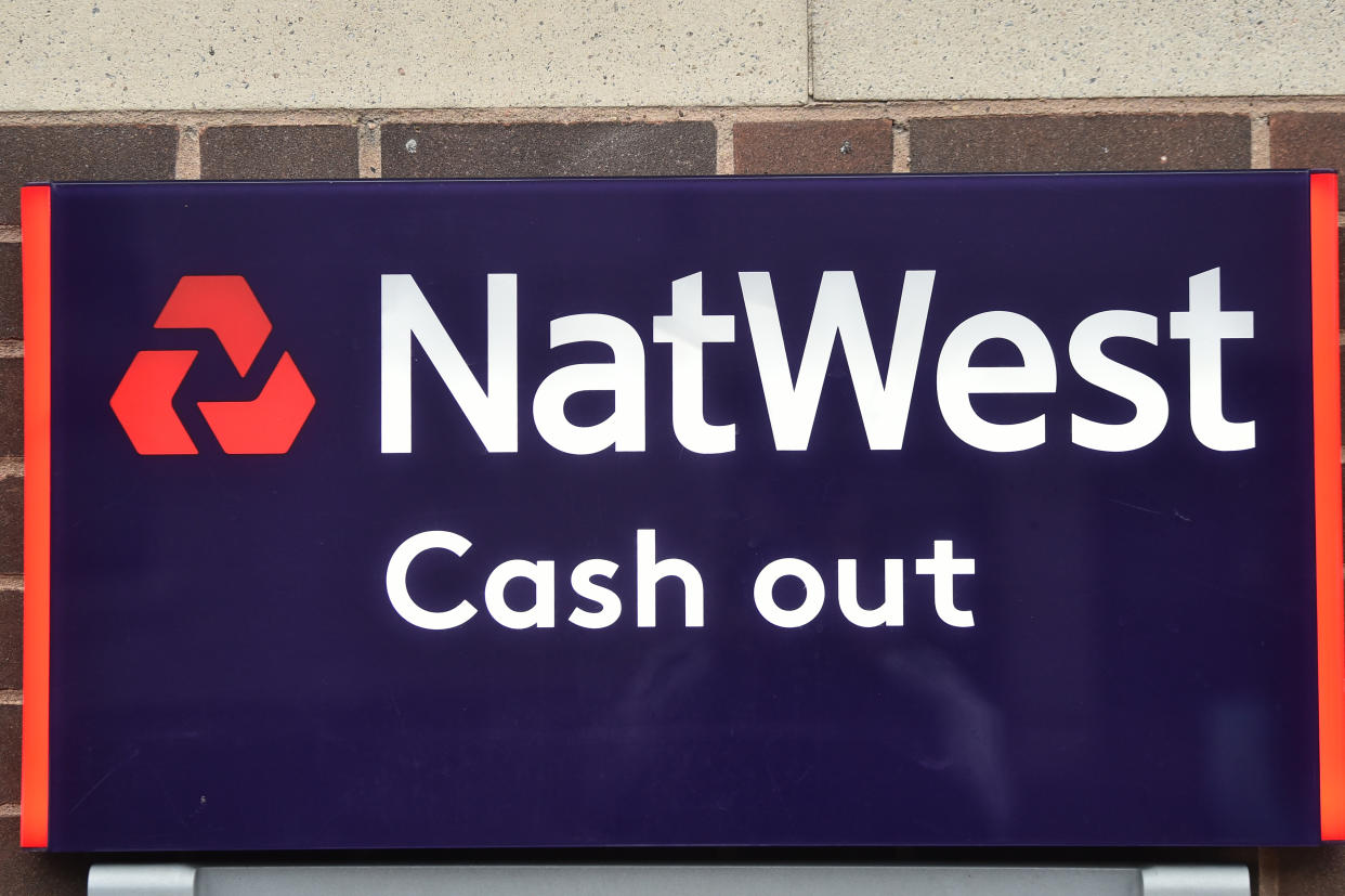 NEWCASTLE-UNDER-LYME, ENGLAND - OCTOBER 30: A NatWest Bank cash out sign in seen on October 30, 2020 in Newcastle-under-Lyme, England. HSBC Chief Executive Noel Quinn said the bank will review pricing strategy for fees and lending to make sure they have a sustainable and profitable business, amid the record-low interest rates. (Photo by Nathan Stirk/Getty Images)