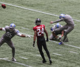 Detroit Lions kicker Matt Prater, right, makes the extra point-attempt to defeat the Atlanta Falcons with Falcons cornerback A.J. Terrell looking on as time expires in an NFL football game Sunday, Oct. 25, 2020, in Atlanta. (Curtis Compton/Atlanta Journal-Constitution via AP)