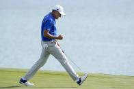 Team Europe's Ian Poulter reacts after making a putt on the 12th hole during a foursome match the Ryder Cup at the Whistling Straits Golf Course Friday, Sept. 24, 2021, in Sheboygan, Wis. (AP Photo/Charlie Neibergall)