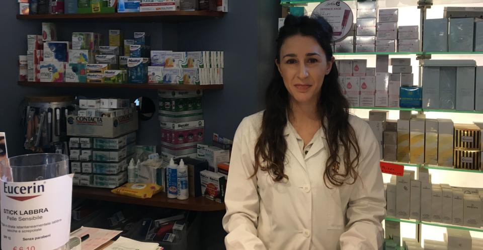 Benedetta Alabardi works at a pharmacy a few blocks from the Vatican. She opposes Trump because of his plans to build a border wall with Mexico. (Photo: SV Date/Huffington Post)