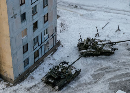 Tanks are seen in the government-held industrial town of Avdiyivka, Ukraine. REUTERS/Gleb Garanich