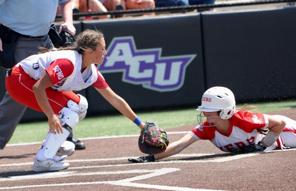 Coahoma's Karleigh Burt tags out Holliday's Evelyn Perkins.