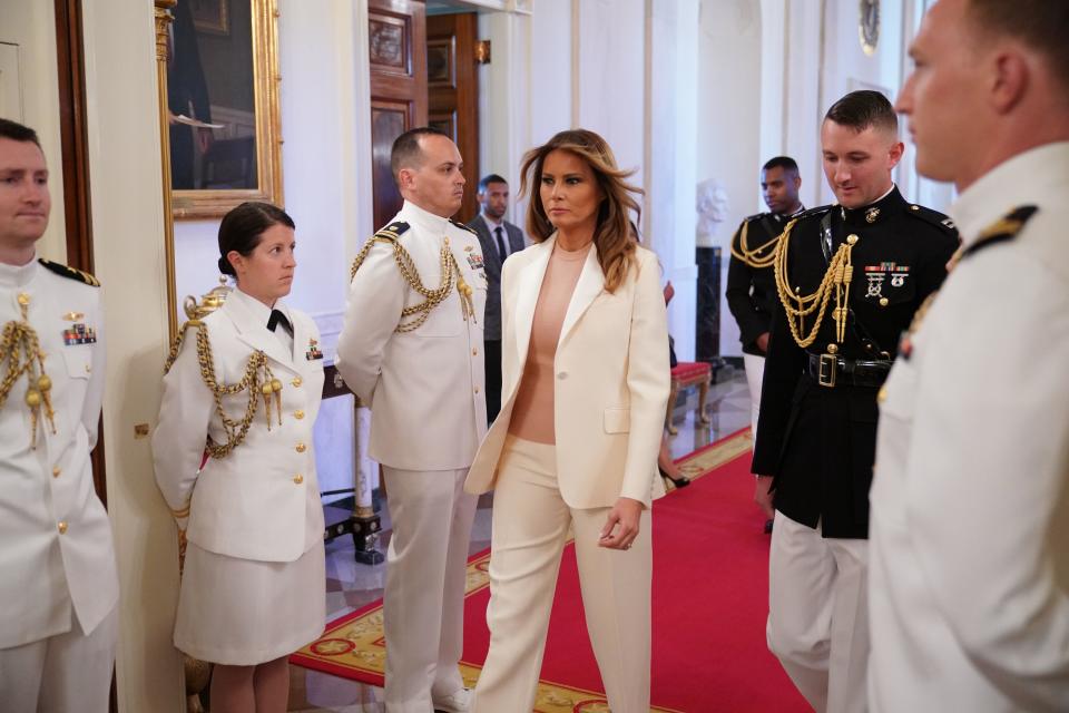 Melania Trump arrives at the Medal of Freedom ceremony wearing white Dior suit [Photo: Getty]