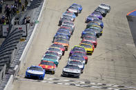 Kyle Busch leads the field to the green flag to start a NASCAR Cup Series auto race at Dover Motor Speedway, Sunday, April 28, 2024, in Dover, Del. (AP Photo/Derik Hamilton)
