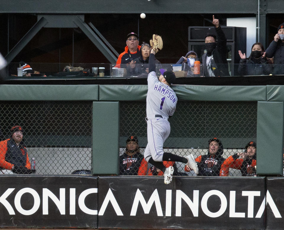 Colorado Rockies center fielder Garrett Hampson (1) leaps in vain for San Francisco Giants' Mauricio Dubón's two-run home run during the third inning of a baseball game, Monday, May 9, 2022, in San Francisco. (AP Photo/D. Ross Cameron)