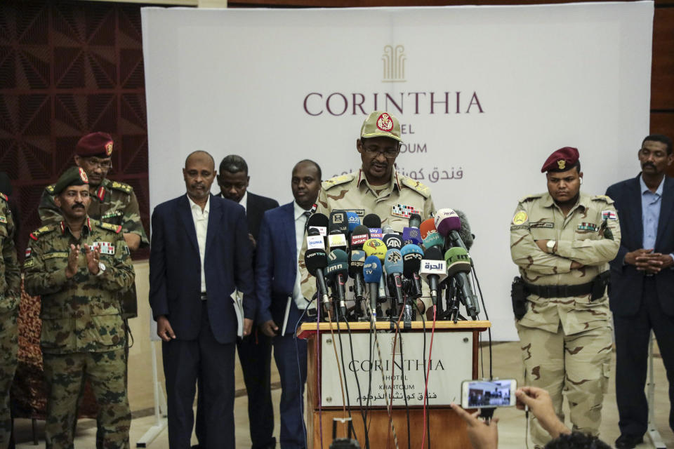 Gen. Mohammed Hamdan Dagalo speaks after signing a power sharing document with Sudan's pro-democracy movement and the ruling military council in Khartoum, Sudan, Wednesday, July 17, 2019. The two sides are still at work on a more contentious constitutional agreement that would specify the division of powers. (AP Photo/Mahmoud Hjaj)