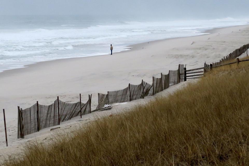 A lone man stands along the Ortley Beach coastline Tuesday, January 5, 2022.