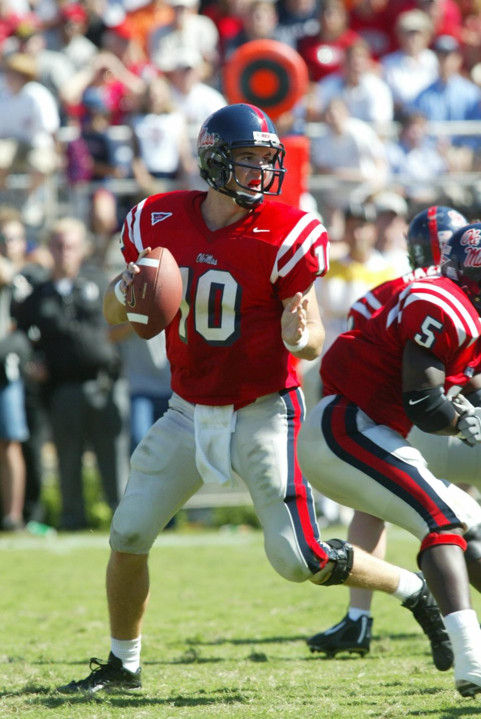 Former Ole Miss quarterback Eli Manning gets ready to throw in his college days with the Rebels.