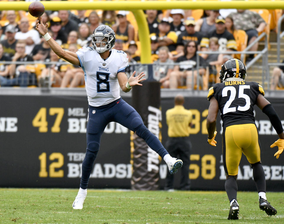 File-This Aug. 25, 2018, file photo shows Tennessee Titans quarterback Marcus Mariota (8) getting a pass away as Pittsburgh Steelers cornerback Artie Burns (25) rushes him in the first half of an NFL preseason football game, in Pittsburgh. Mariota’s emergence as one of the NFL’s top young stars helped provide proof that a good quarterback can be found in the state of Hawaii. (AP Photo/Don Wright, File)