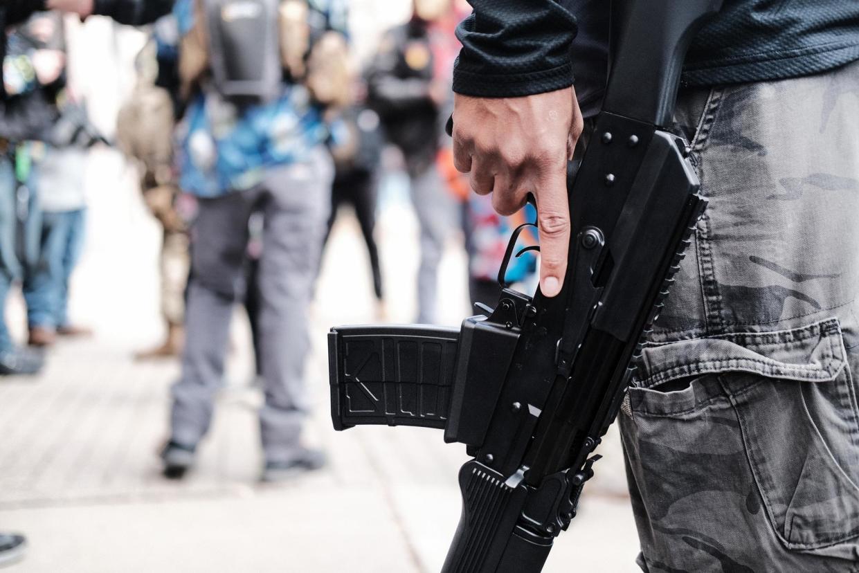 <span>Members of the ‘boogaloo boys’ join other gun rights advocates in Richmond, Virginia, on 18 January 2021.</span><span>Photograph: Spencer Platt/Getty Images</span>