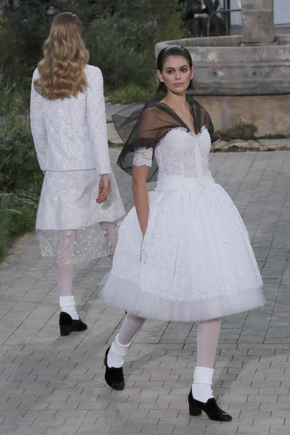 Model Kaia Gerber wears a creation for the Chanel Haute Couture Spring/Summer 2020 fashion collection presented Tuesday Jan. 21, 2020 in Paris. (AP Photo/Francois Mori)