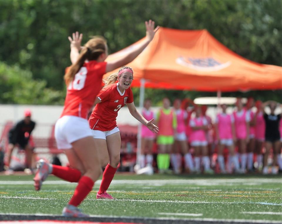Chatham Glenwood's Lyla Franke races toward teammate Rowann Law after the latter scored the go-ahead goal in the first overtime of the Class 2A girls soccer state championship game against Lisle Benet Academy at Benedetti–Wehrli Stadium in Naperville on Saturday, June 3, 2023.