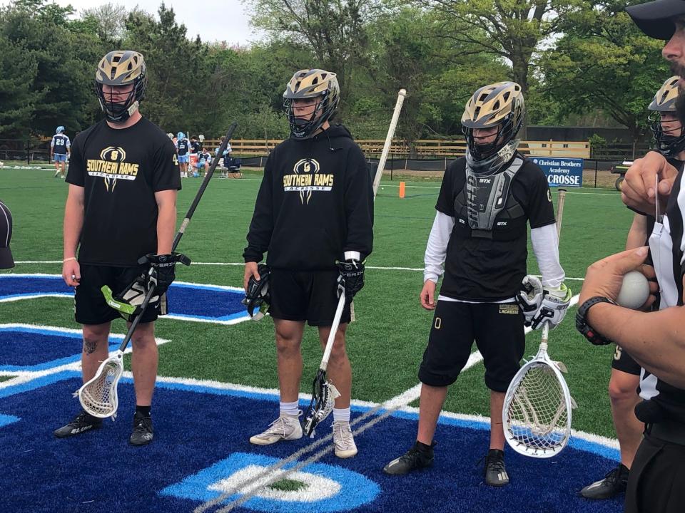 Southern Regional boys lacrosse team meets with the officials before the game against CBA on May 12, 2022