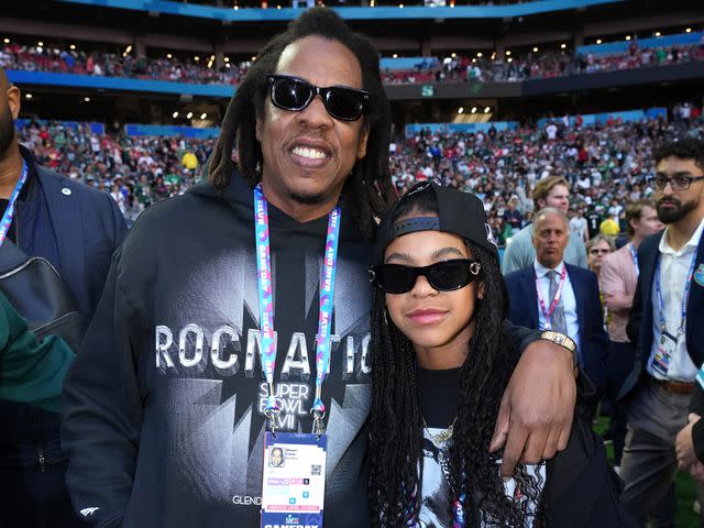 <p>Kevin Mazur/Getty</p> Jay-Z and Blue Ivy Carter attend Super Bowl LVII