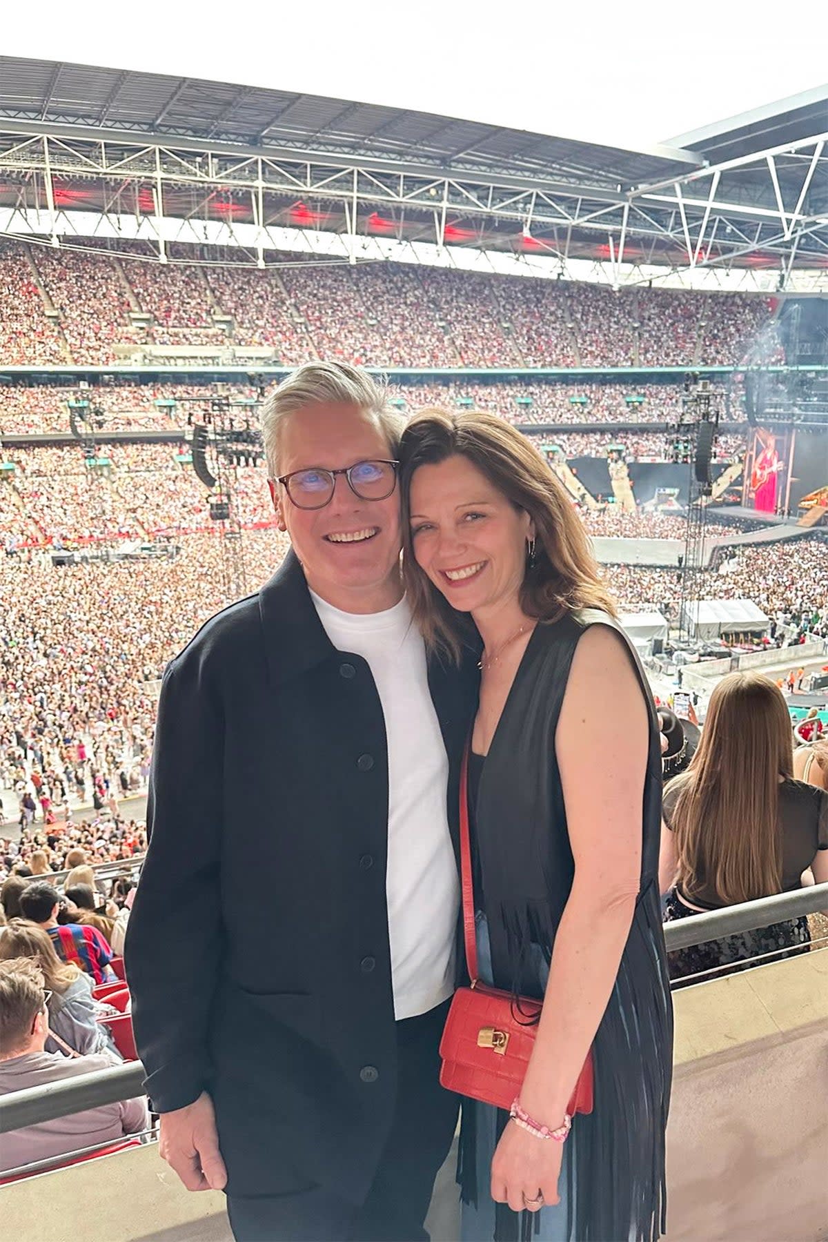 At the time, Sir Keir shared a sweet picture of himself and his wife Victoria in front of the 90,000 strong crowd as they looked on from a hospitality booth. (Keir Starmer/X)