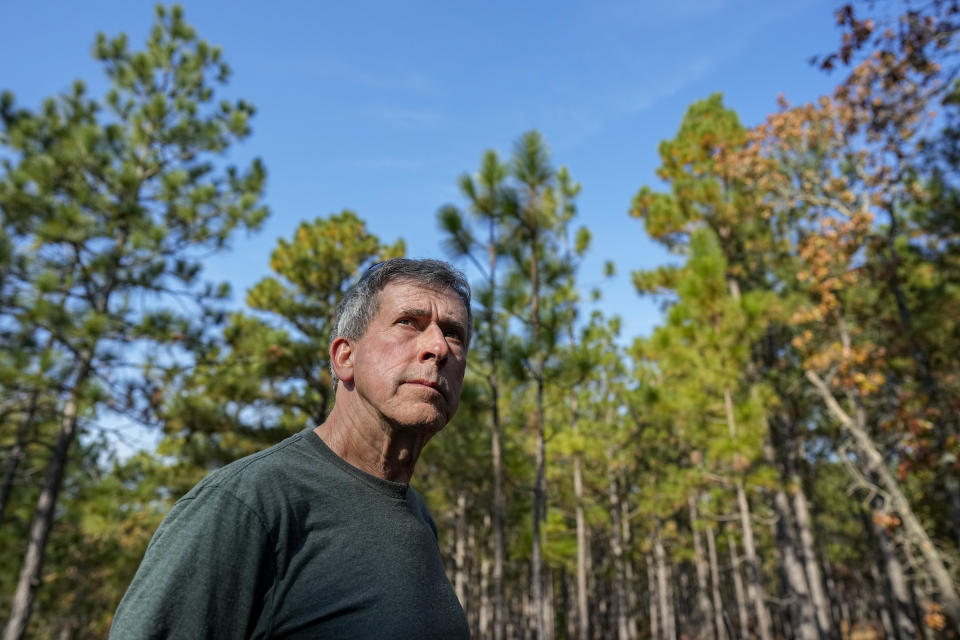 Jesse Wimberley poses for a photo at his property Wednesday, Nov. 8, 2023, in West End, N.C. Grassroots forest burners are proving key to restoring a fire-loving ecosystem across the South. (AP Photo/Chris Carlson)