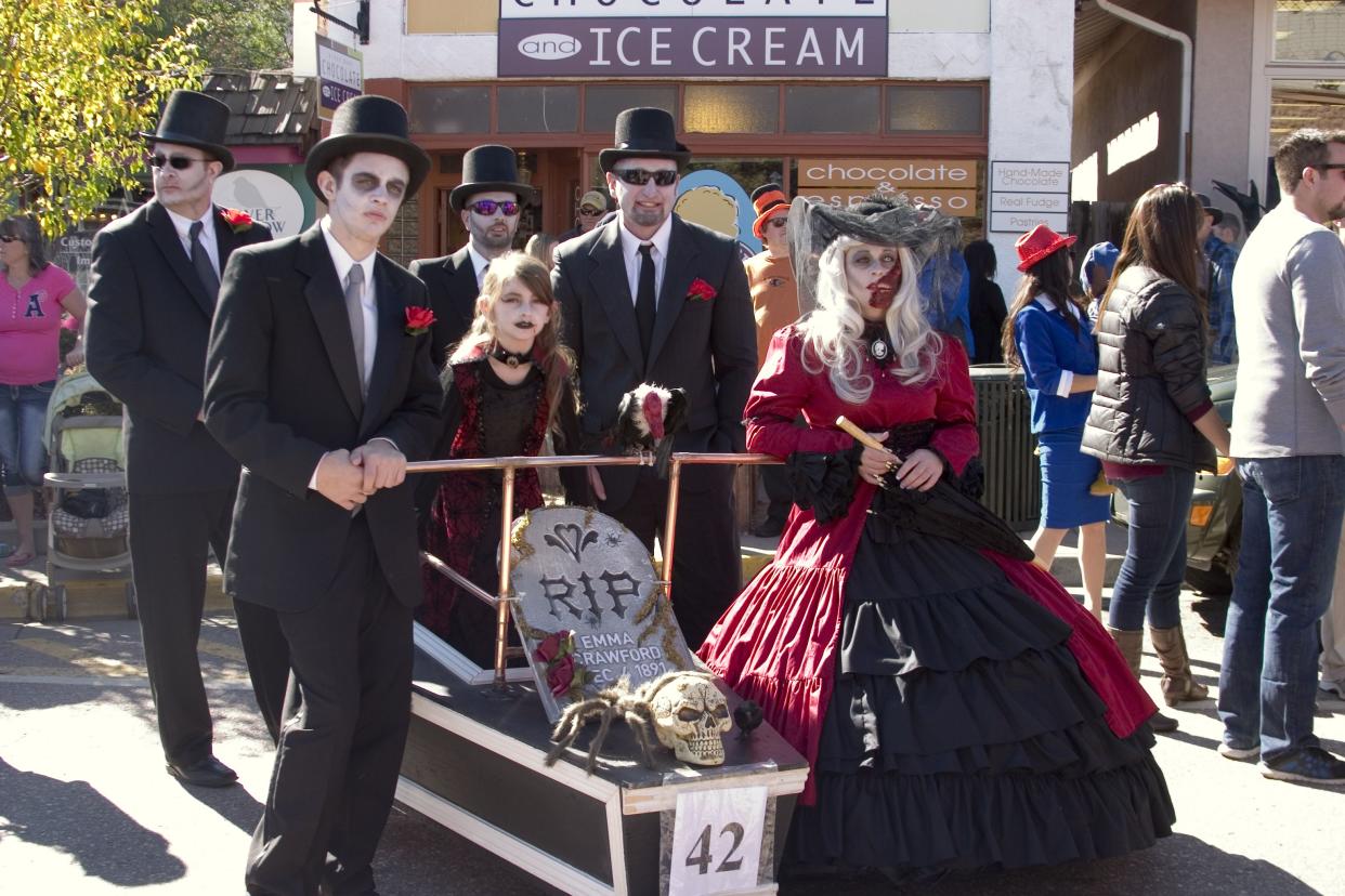 Manitou Springs, Colorado, USA - October 24, 2015: Costumed people celebrating Halloween and particpating in the annual Emma Crawford Coffin Races along Manitou Avenue in Manitou Springs, Colorado
