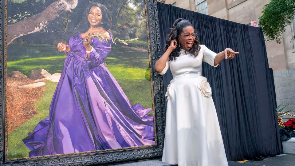 Oprah Winfrey shouts out to a member of the crowd, during her portrait unveiling ceremony at Smithsonian's National Portrait Gallery in Washington on Wednesday - Jacquelyn Martin/AP