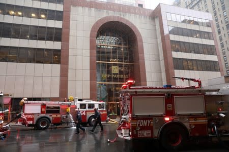New York City Fire Department trucks outside 787 7th Avenue in midtown Manhattan where helicopter crashed in New York