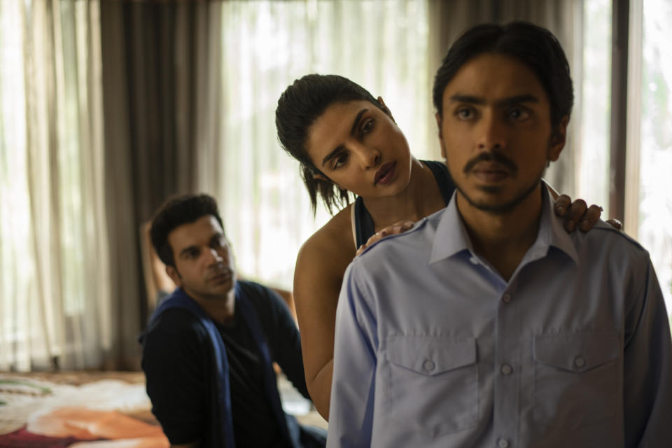 This image released by Netflix shows ​Rajkummar Rao, from left, Priyanka Chopra and Adarsh Gourav ​in a scene from "The White Tiger." (Tejinder Singh Khamkha​/Netflix via AP)