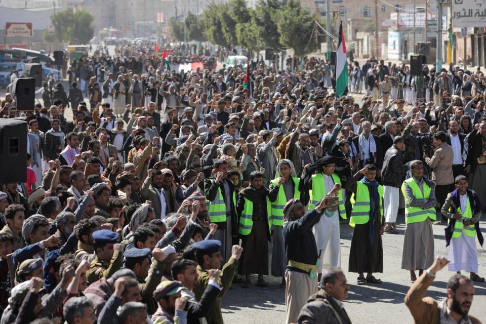 Houthi supporters shout slogans as they attend a ceremony at the end of the training of newly recruited fighters in Sanaa (REUTERS)