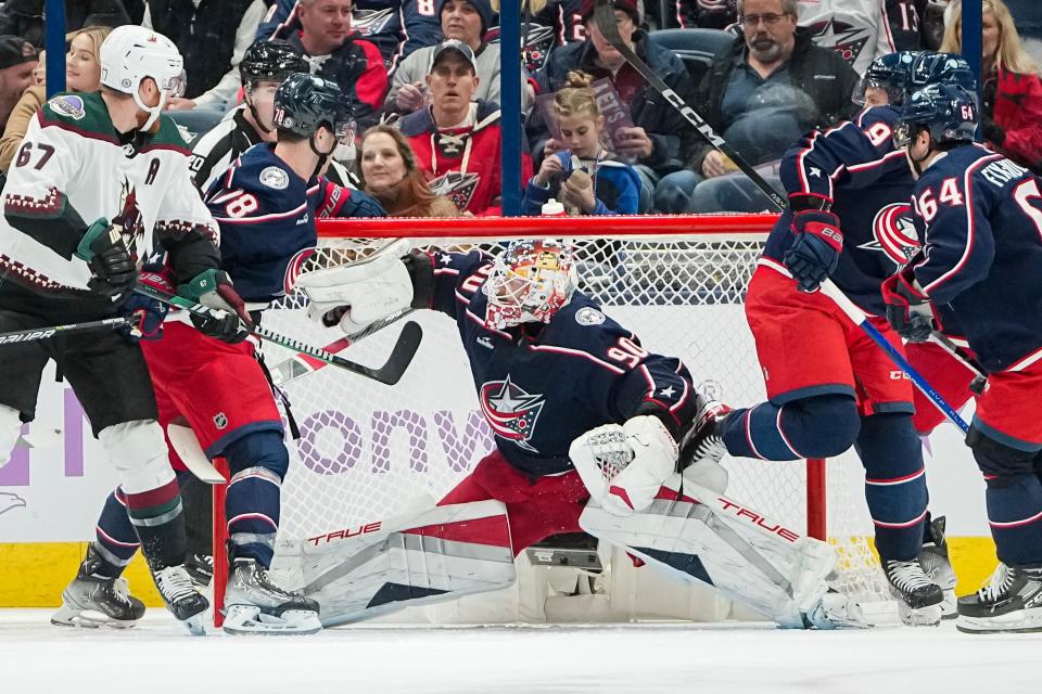 Nov 16, 2023; Columbus, Ohio, USA; Columbus Blue Jackets goaltender Elvis Merzlikins (90) stops a shot during the first period of the NHL hockey game against the Arizona Coyotes at Nationwide Arena.