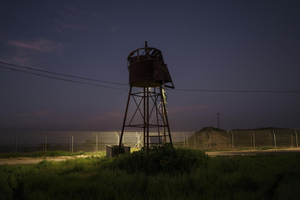 An old observation tower stands near the fence of Kibbutz Nahal Oz, Israel, Wednesday, Feb. 28, 2024. (AP Photo/Leo Correa)