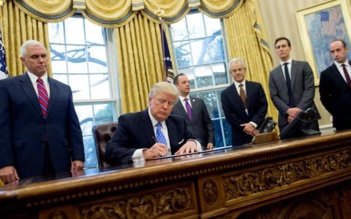 Swedish deputy Prime Minister appears to troll Donald Trump by 'copying' his controversial executive order photo