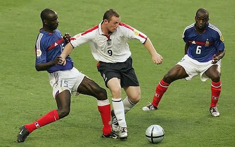 Wayne Rooney of England gets past LilianThuram of France during the France v England Group B match - Credit:  Phil Cole/Getty Images 