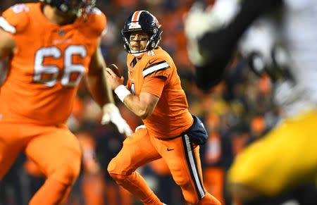 Nov 25, 2018; Denver, CO, USA; Denver Broncos quarterback Case Keenum (4) scrambles in the fourth quarter against the Pittsburgh Steelers at Broncos Stadium at Mile High. Mandatory Credit: Ron Chenoy-USA TODAY Sports