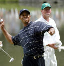 <p>Defending Masters champion Tiger Woods tosses his golf ball to the gallery gathered at the 9th hole after finishing the Par 3 Contest at the Augusta National Golf Club Wednesday, April 10, 2002, in Augusta, Ga. First round play of the 2002 Masters begins on Thursday. (AP Photo/Doug Mills) </p>