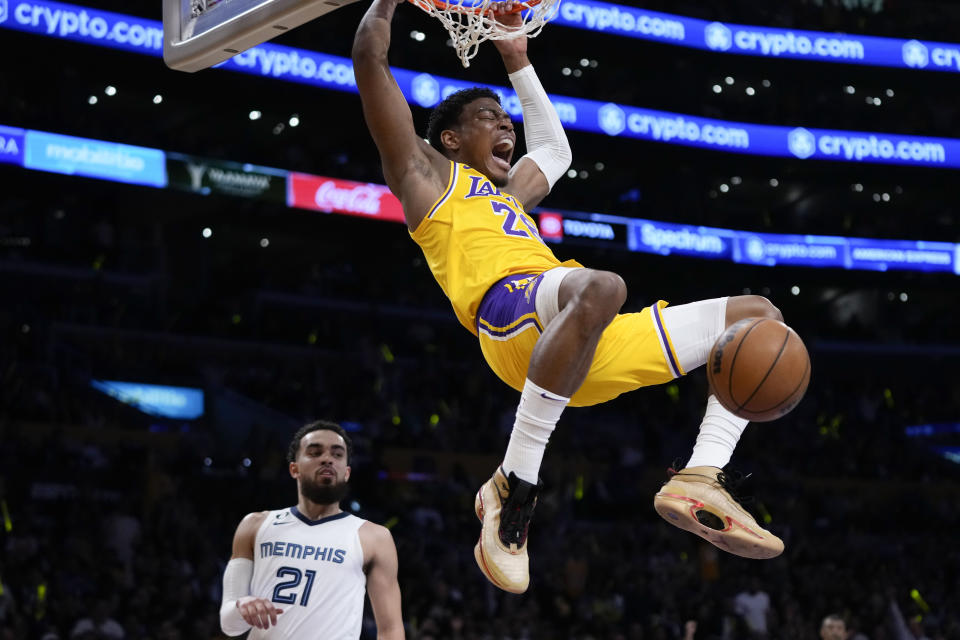Los Angeles Lakers' Rui Hachimura (28) celebrates his dunk as Memphis Grizzlies' Tyus Jones (21) watches during the first half in Game 6 of a first-round NBA basketball playoff series Friday, April 28, 2023, in Los Angeles. (AP Photo/Jae C. Hong)
