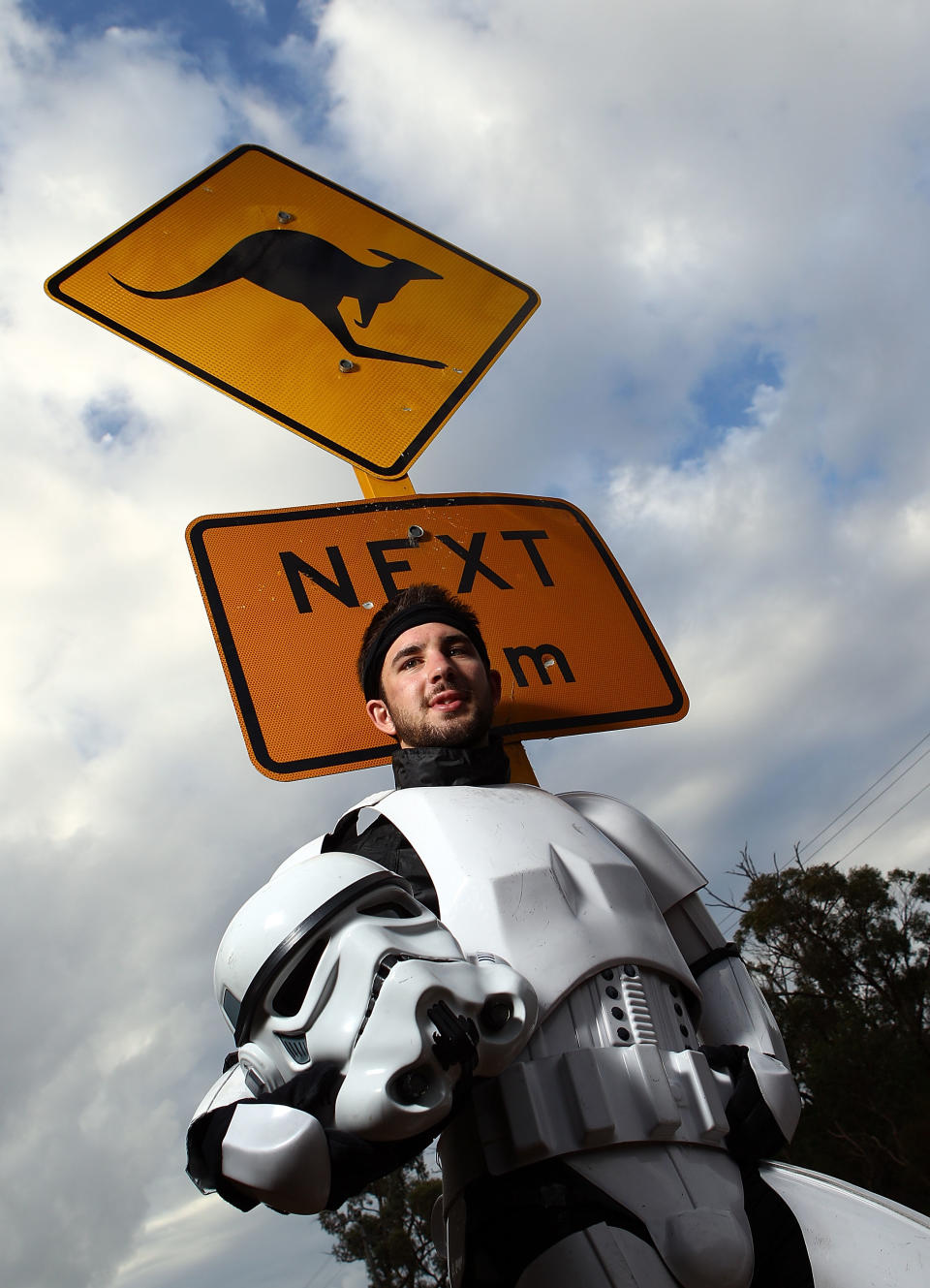 PERTH, AUSTRALIA - JULY 15: Stormtrooper Paul French is pictured on day 5 of his over 4,000 kilometre journey from Perth to Sydney taking a rest break on Old Mandurah Road on July 15, 2011 in Perth, Australia. French aims to walk 35-40 kilometres a day, 5 days a week, in full Stormtrooper costume until he reaches Sydney. French is walking to raise money for the Starlight Foundation - an organisation that aims to brighten the lives of ill and hostpitalised children in Australia. (Photo by Paul Kane/Getty Images)