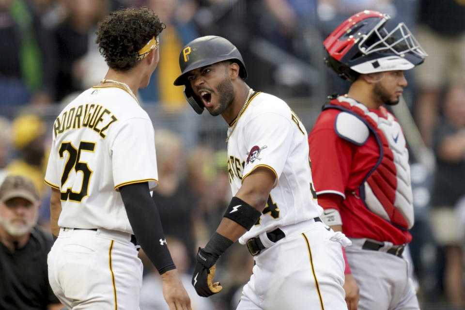 Pittsburgh Pirates' Joshua Palacios, center, celebrates with Endy Rodriguez. left, after hitting a two-run home run off Washington Nationals starting pitcher Joan Adon during the second inning of a baseball game in Pittsburgh, Tuesday, Sept. 12, 2023. (AP Photo/Matt Freed)