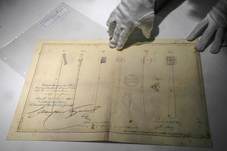 The facsimile of the patent for the first pivot toothbrush, dated 1845, at the perfumer's archives department in Paris, Tuesday, May 30, 2023. Guerlain, the house which invented modern perfumery, has for the first time in its history created an archive to delve into its pioneering and history making past. (AP Photo/Michel Euler)