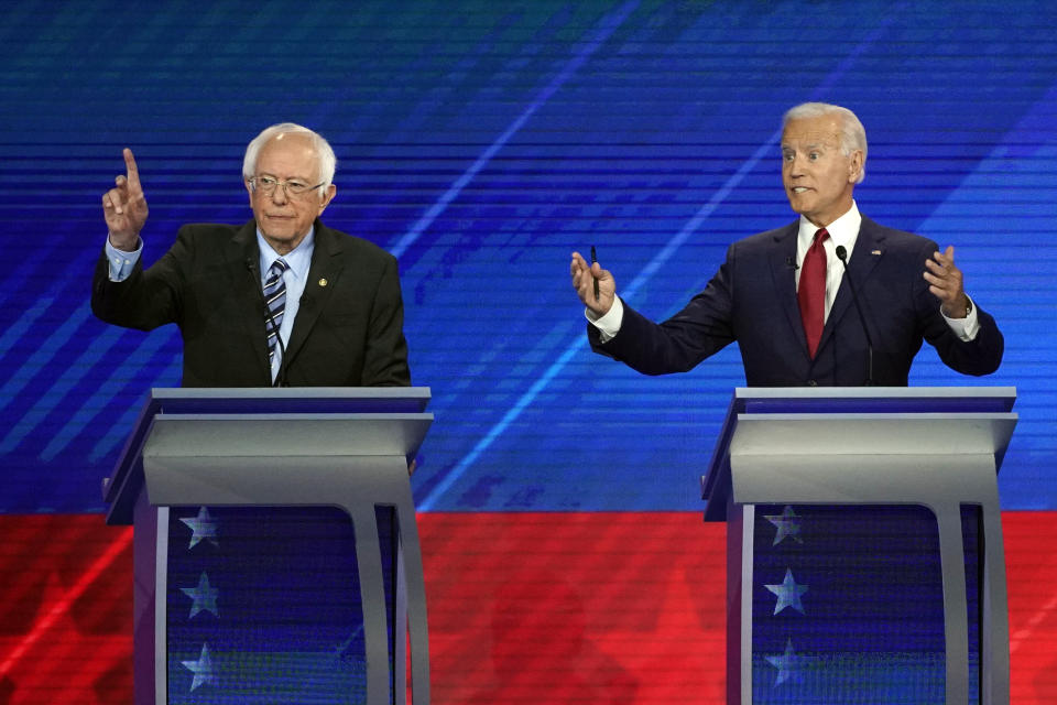 Sen. Bernie Sanders, I-Vt., left, and former Vice President Joe Biden, right, speak Thursday, Sept. 12, 2019, during a Democratic presidential primary debate hosted by ABC at Texas Southern University in Houston. (AP Photo/David J. Phillip)