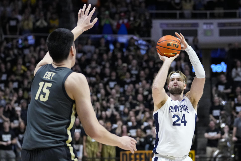 Penn State forward Michael Henn (24) shoots over Purdue center Zach Edey (15) during the first half of an NCAA college basketball game in West Lafayette, Ind., Wednesday, Feb. 1, 2023. (AP Photo/Michael Conroy)