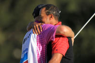 THOUSAND OAKS, CA - DECEMBER 04: Tiger Woods hugs his caddie Joe Lacava on the 18th hole after winning the Chevron World Challenge at Sherwood Country Club on December 4, 2011 in Thousand Oaks, California. Woods finished at 10 under par to beat Zach Johnson by one stroke. (Photo by Scott Halleran/Getty Images)