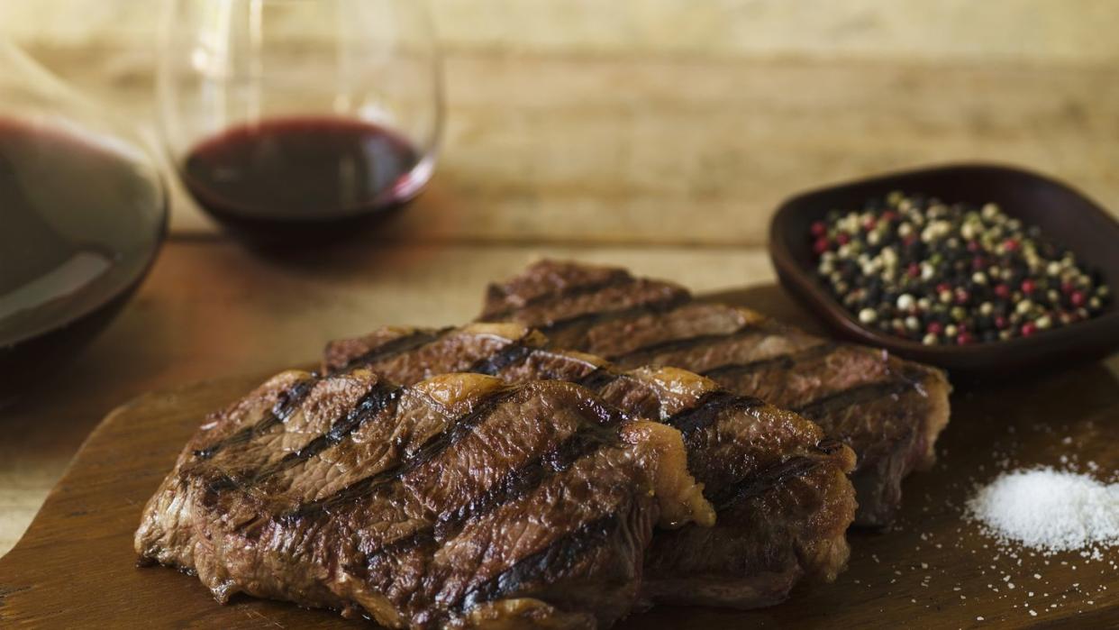 steak dinner with peppercorn and salt seasonings