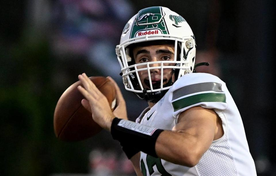 Sebastian Meija looks for a receiver to pass to during the game between Lakewood Ranch and Braden River on Friday, Sept. 8, 2023.