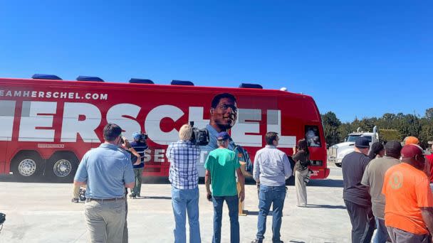 PHOTO: Herschel Walker voters gather outside his campaign bus at a stop in Wadley, Ga., Oct. 6, 2022. (Rachel Scott/ABC News)