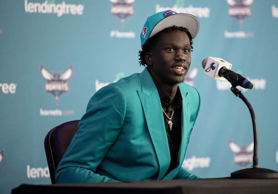 Charlotte Hornet second-round draft pick J.T. Thor speaks during a press conference at the Spectrum Center in Charlotte on Friday. Thor said he already owned the suit in Charlotte colors that he wore to the news conference.