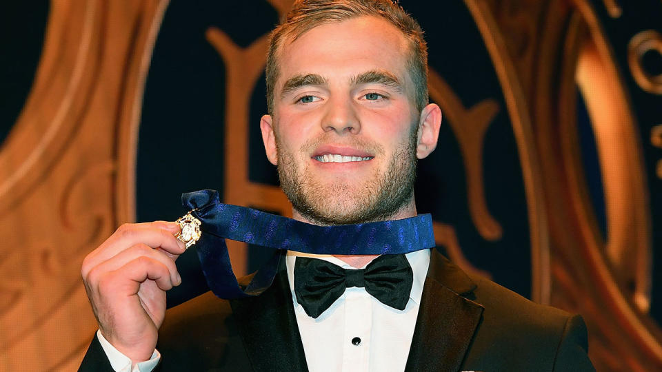 Tom Mitchell poses with the 2018 Brownlow Medal. (Photo by Quinn Rooney/Getty Images)