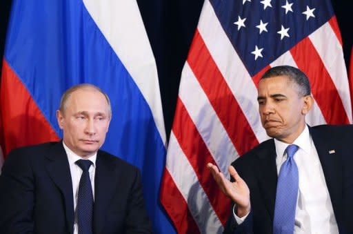 US President Barack Obama (R) gives the floor to Russian President Vladimir Putin to speak after a bilateral meeting in Los Cabos, Mexico on June 18, 2012 on the sidelines of the G20 summit. Obama and Putin have called for an "immediate" end to the Syria conflict