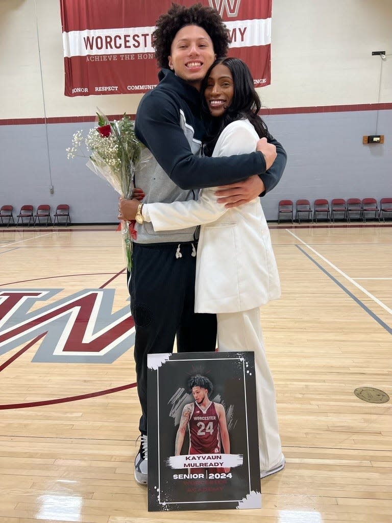 Worcester's Kayvaun Mulready embraces his mother Trafficia Warburton on Senior Night at Worcester Academy.