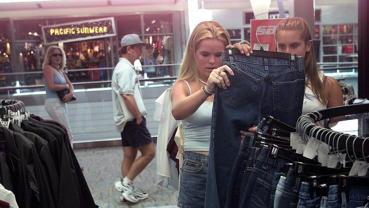 erin dwyer, 16, left, and lauren semchenko, 15, shop for clothes inside rave stoe located inside pac