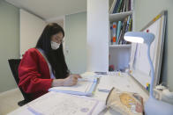 Ma Seo-bin, a high school senior at an elite, , expensive foreign language school near Seoul, studies at her home in Siheung, South Korea, on Sept. 19, 2020. “I felt I was trapped at the same place and I got lots of psychological stress,” said Ma. When South Korea began its delayed school year with remote learning in April, that spelled trouble for low-income students who rely on public education, get easily distracted and cannot afford private schools or tutors used by many in this education-obsessed country. (AP Photo/Ahn Young-joon)